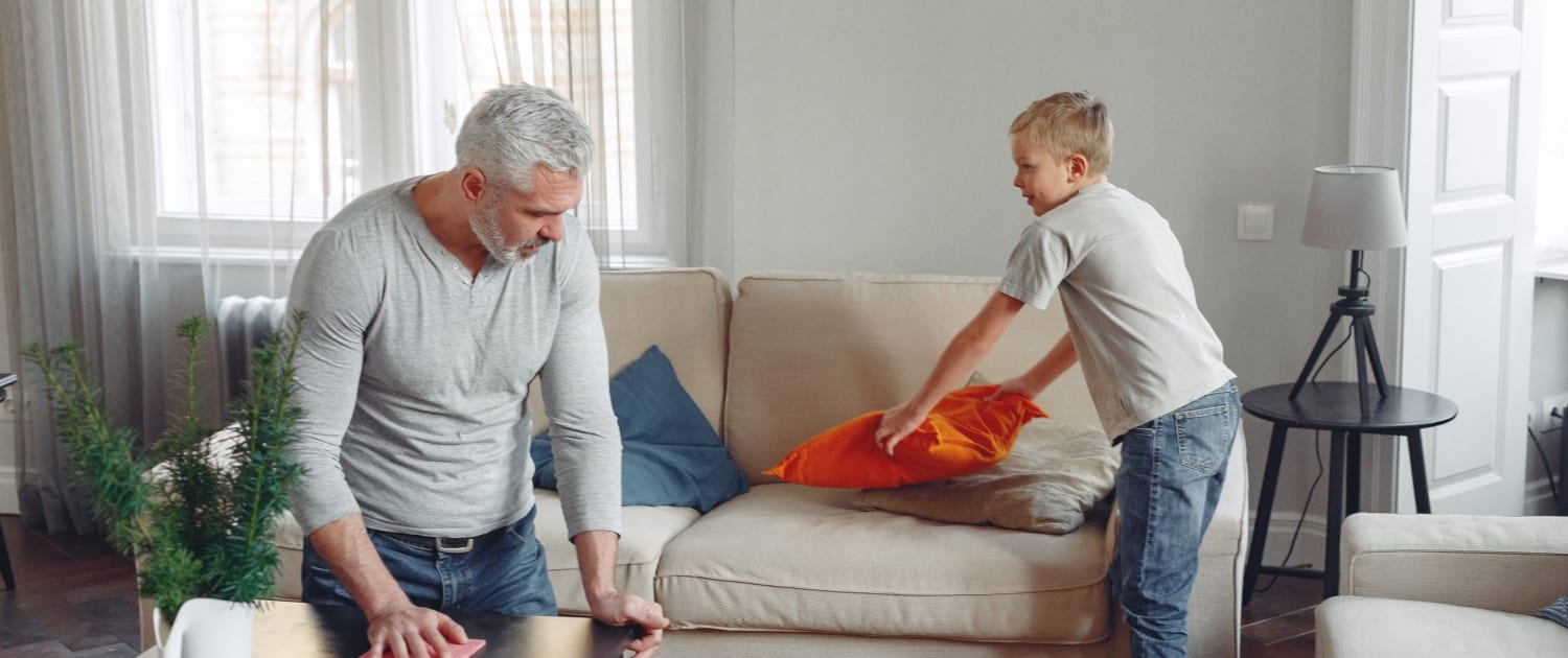 father and son cleaning house