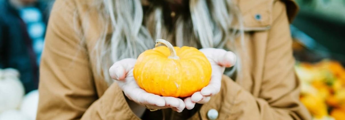 woman holding pumpkin Halloween
