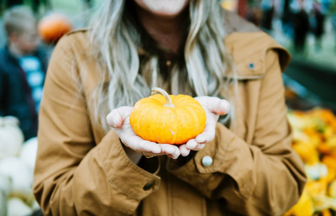 woman holding pumpkin Halloween